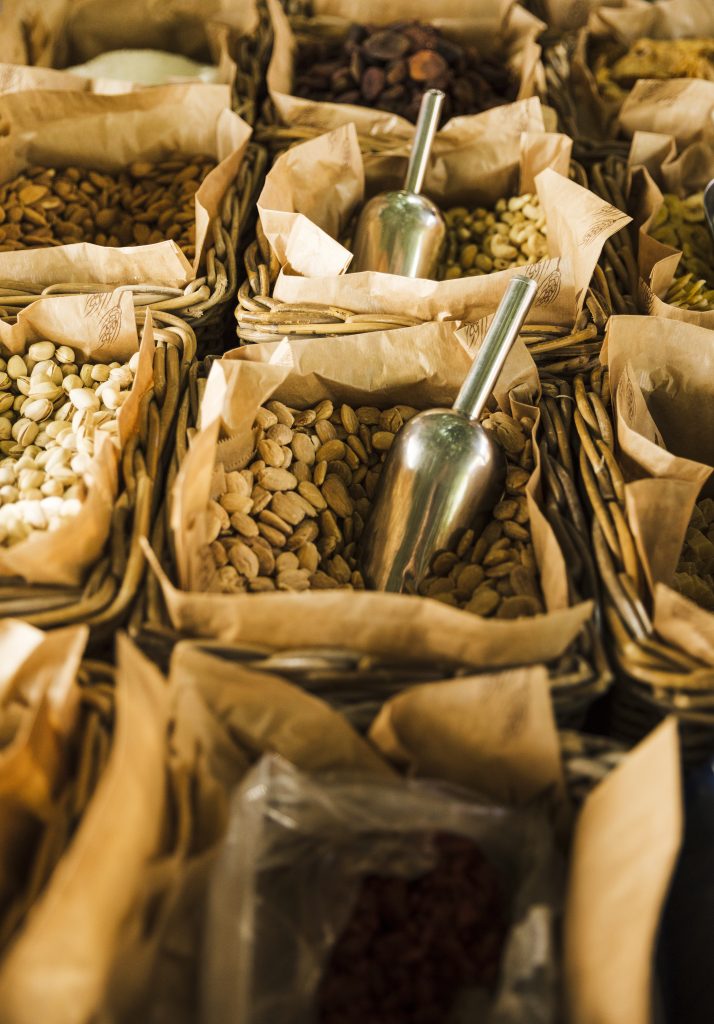 market stall with various dried fruits nuts